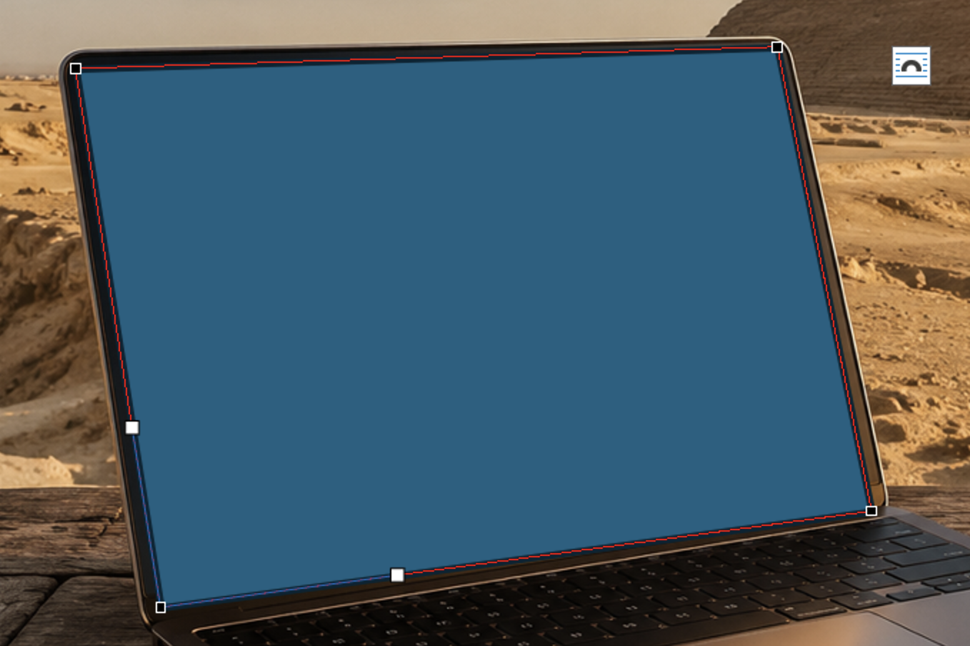 Laptop screen with blue overlay in desert setting : Office-Watch.com